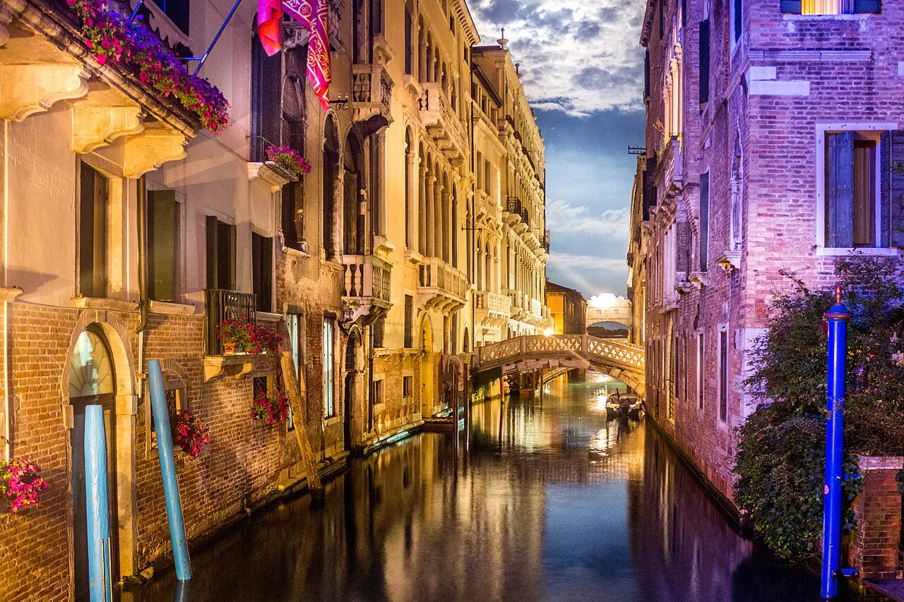 Venice canal and historic buildings after dark, illustrating residential life after the main sightseeing hours