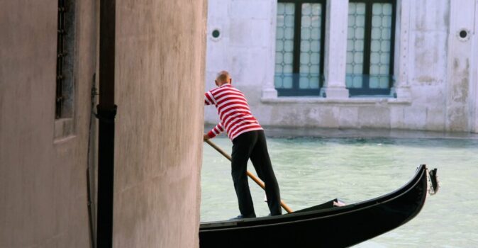 gondola by rialto in a canal