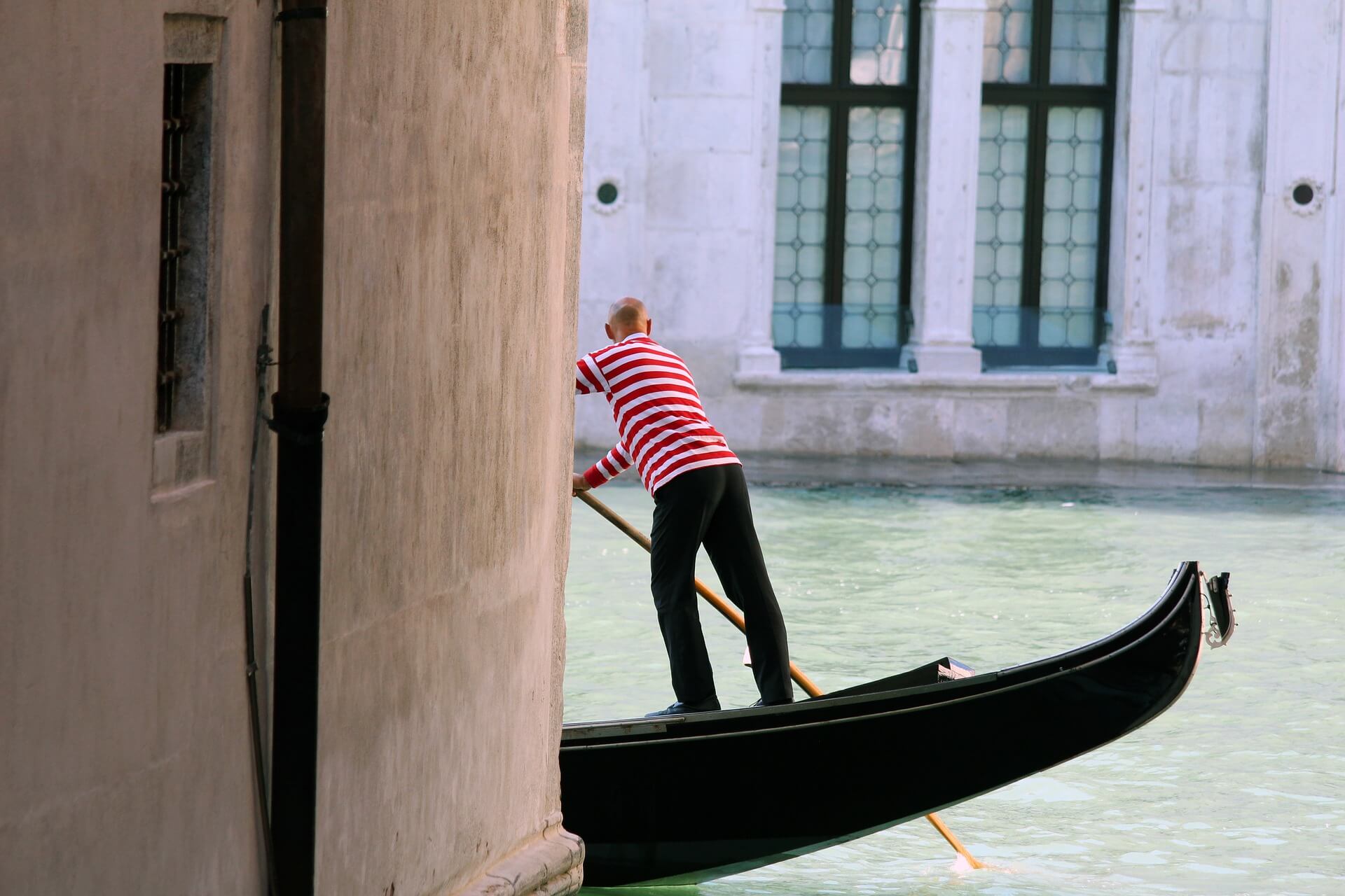 gondola by rialto in a canal