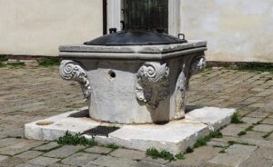 Venetian stone wellhead