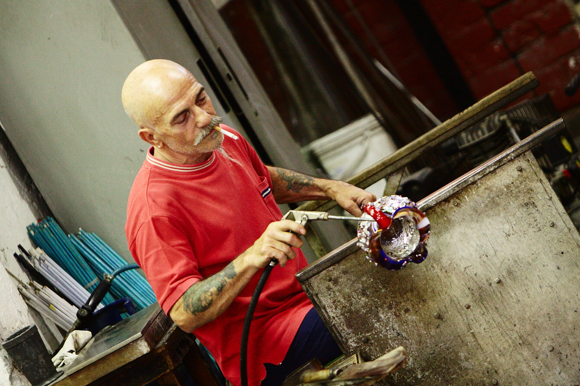 Traditional Murano glassmaker at work in a Venetian glass workshop